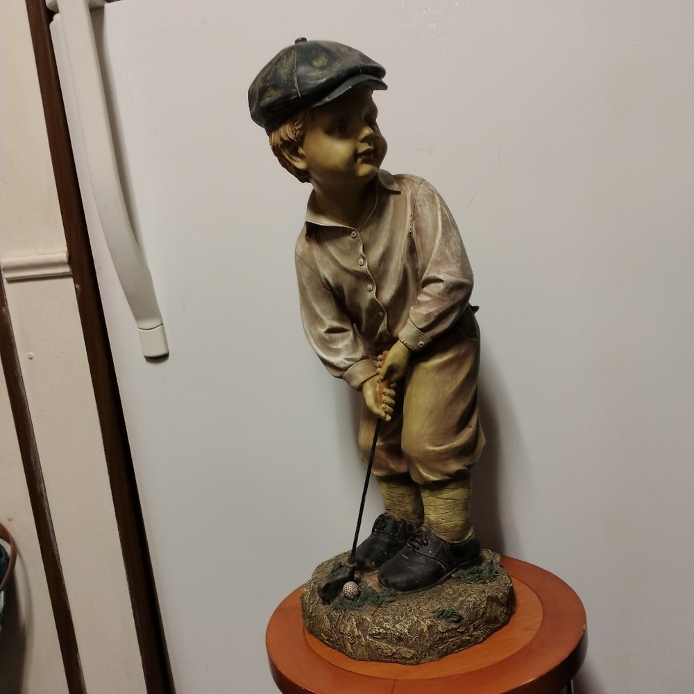 Little golfer and a putter return